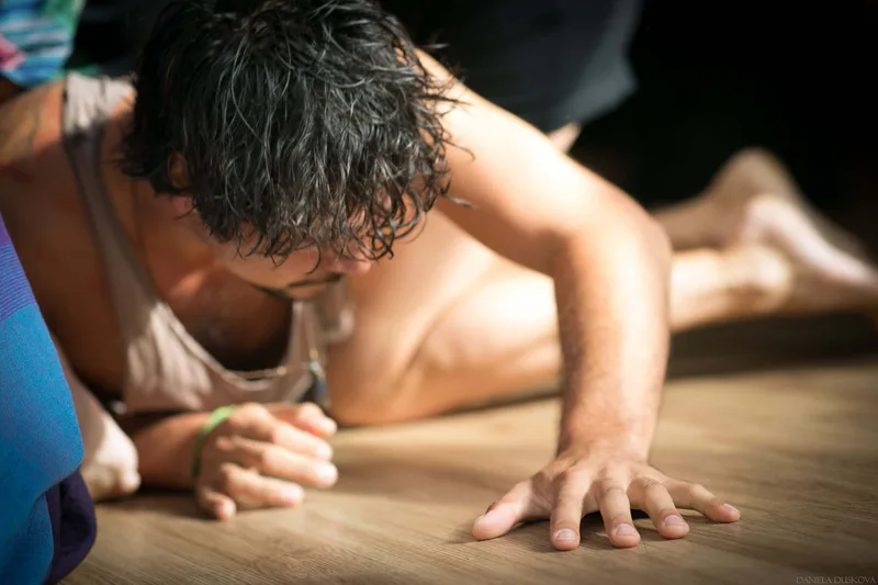 Participant resting on the floor at a festival