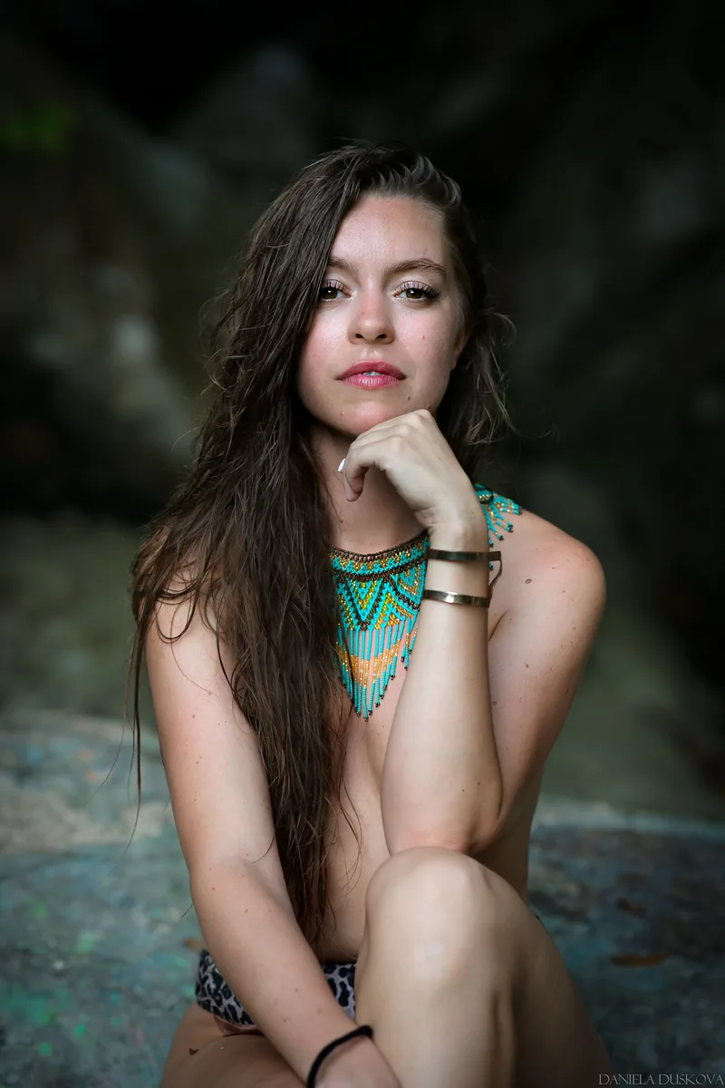 Seated portrait with a turquoise necklace