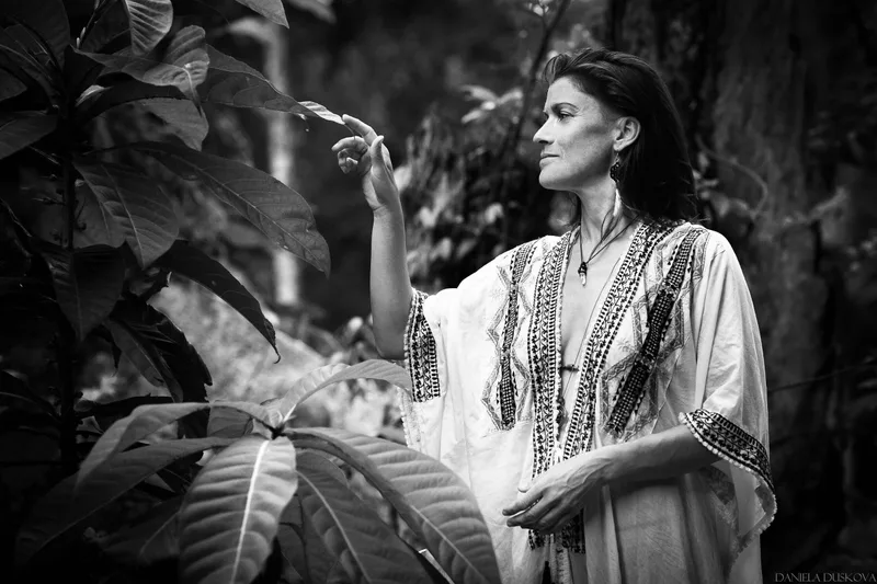 Black-and-white portrait in a forest